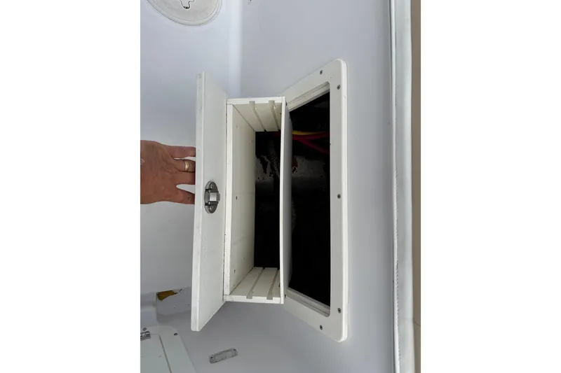 Slide: The Image of Open storage compartment on 2022 Century 2600 Center Console boat. - 58