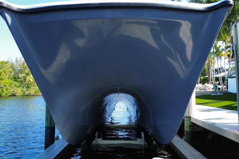Slide: The Image of Underneath view of a 2019 Freeman 42LR boat docked by the water. - 14