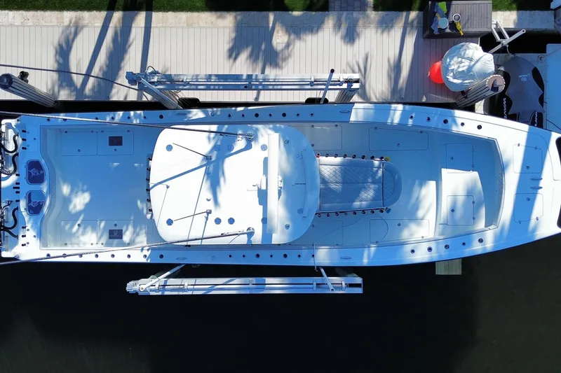 Slide: The Image of Overhead view of a 2019 Freeman 42LR boat docked at a marina. - 17