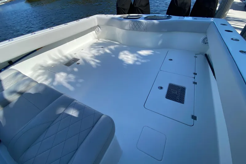 Slide: The Image of Spacious deck of 2019 Freeman 42LR boat with seating and storage compartments. - 21