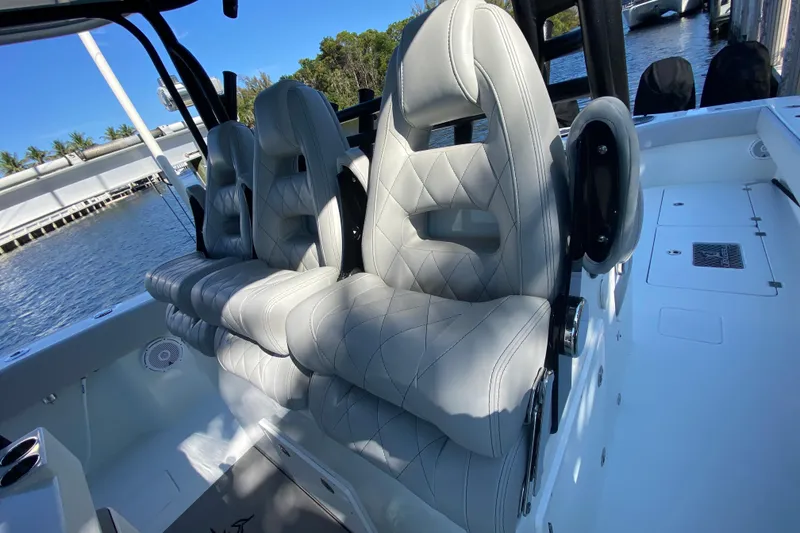 Slide: The Image of Luxurious seating on a 2019 Freeman 42LR boat, featuring elegant diamond-stitched upholstery. - 23