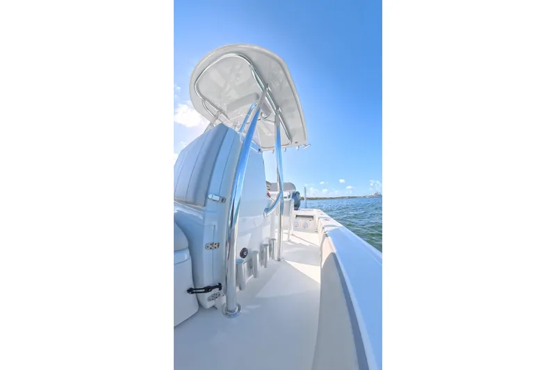 Slide: The Image of 2025 Contender 26 Bay boat on water, showcasing sleek design and modern features. - 20