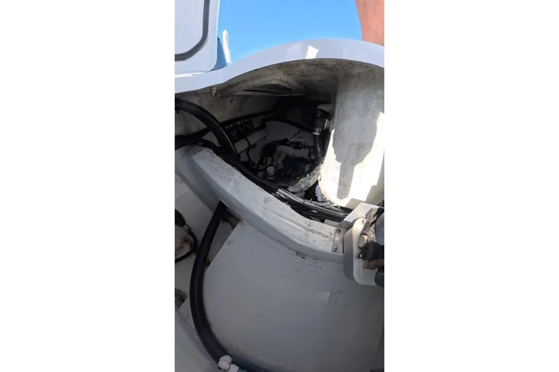 Slide: The Image of 2025 Contender 26 Bay boat interior showing wiring and components. - 23