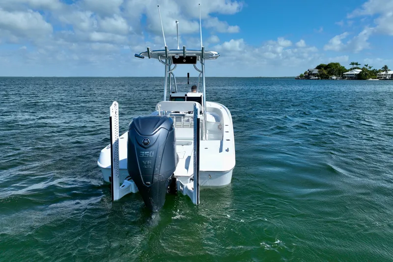 Slide: The Image of 2025 Contender 26 Bay boat with Yamaha 350 V8 engine on open water. - 25