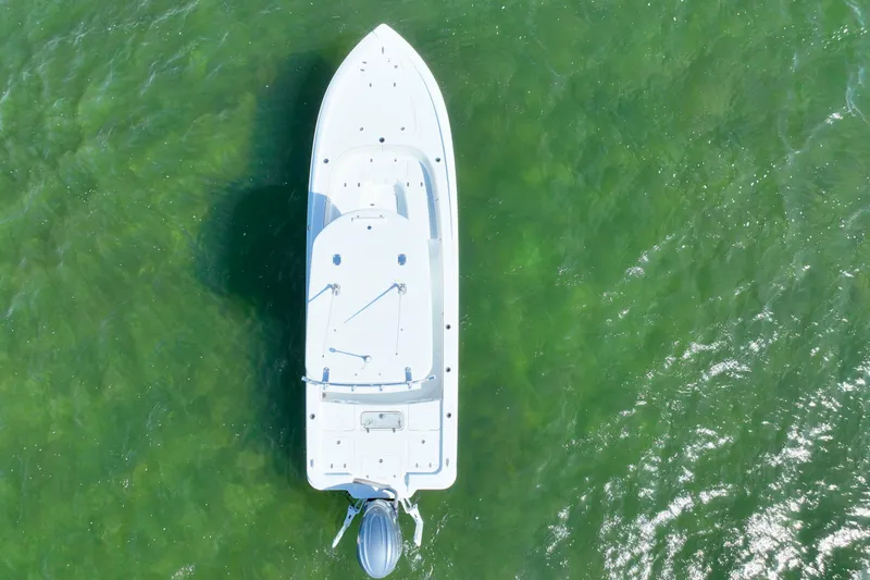 Slide: The Image of Aerial view of 2025 Contender 26 Bay boat on green water. - 33