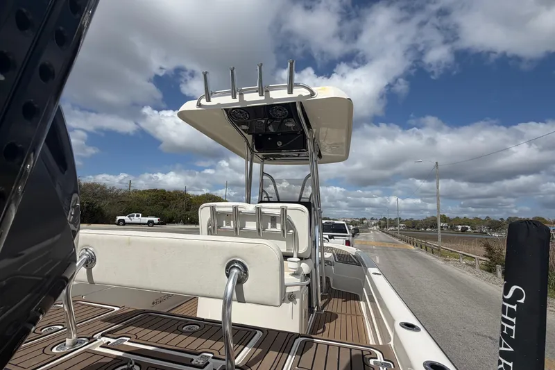 Slide: The Image of 2013 ShearWater 25 LTZ boat on trailer under cloudy sky. - 24