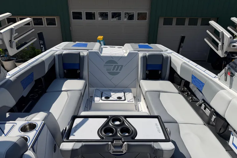Slide: The Image of 2022 Malibu Wakesetter 25 LSV interior with luxurious seating and cup holders. - 12