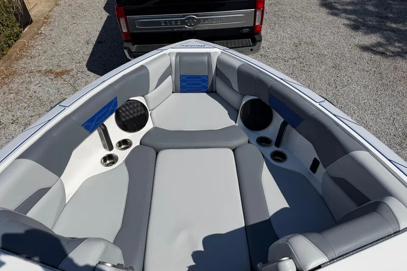 Slide: The Image of Interior of 2022 Malibu Wakesetter 25 LSV boat with gray and blue seating. - 13