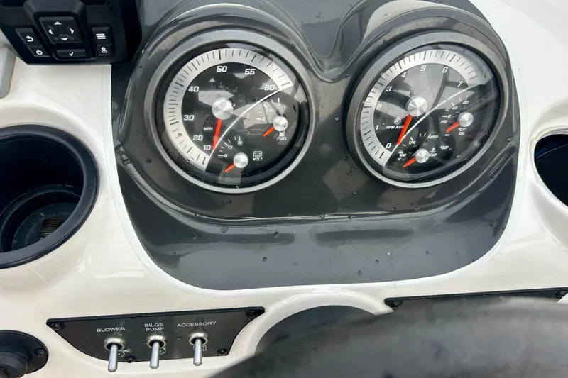 Slide: The Image of Dashboard of a 2016 Bayliner 175 Bowrider with gauges and control switches. - 13