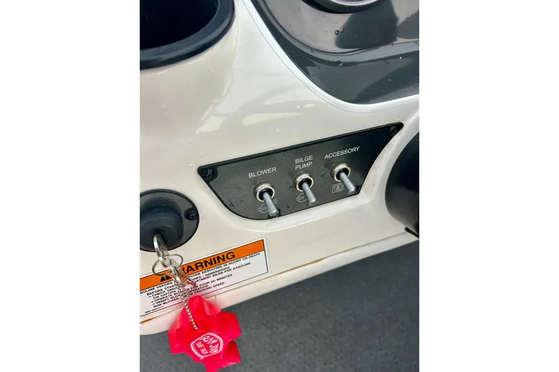 Slide: The Image of Control panel of a 2016 Bayliner 175 Bowrider boat with switches and warning label. - 14