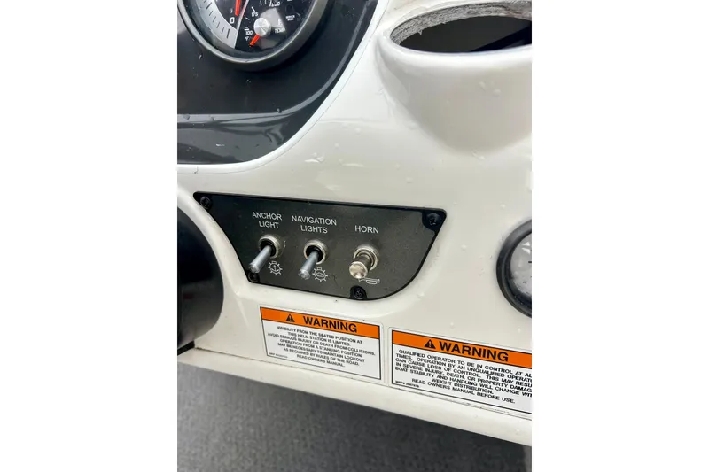 Slide: The Image of Dashboard controls of 2016 Bayliner 175 Bowrider with switches for anchor light, navigation lights, and horn. - 15