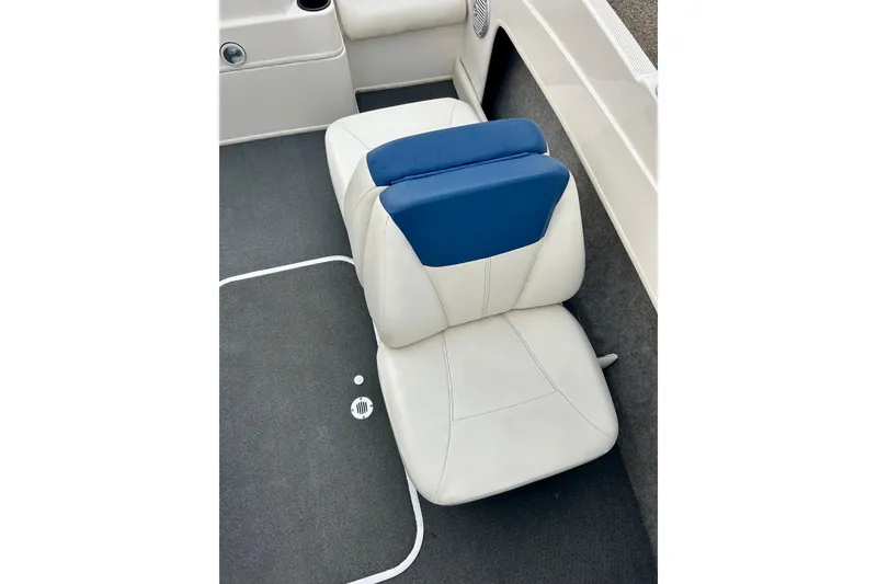 Slide: The Image of White and blue seat in 2016 Bayliner 175 Bowrider boat interior. - 18