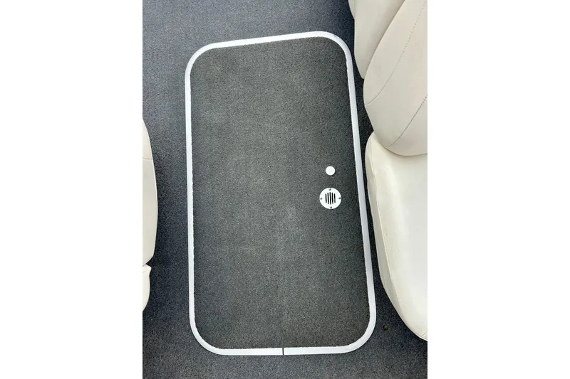 Slide: The Image of 2016 Bayliner 175 Bowrider interior floor with gray carpet and white seating. - 22