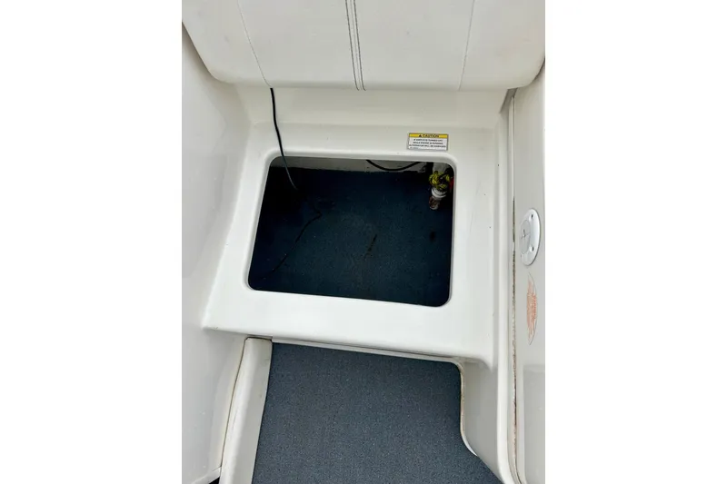 Slide: The Image of 2016 Bayliner 175 Bowrider interior storage compartment with open hatch. - 25