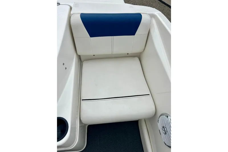 Slide: The Image of 2016 Bayliner 175 Bowrider boat seat with white and blue upholstery. - 27
