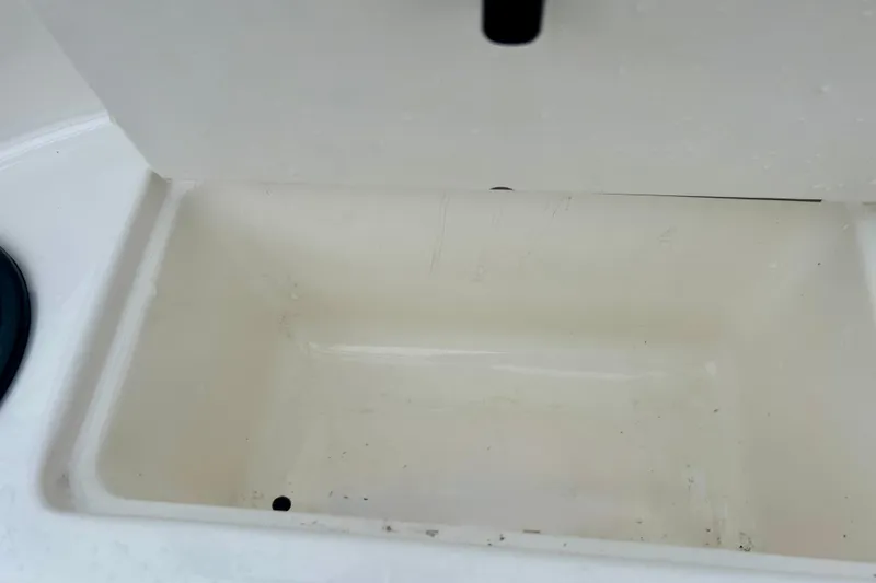 Slide: The Image of Storage compartment of 2016 Bayliner 175 Bowrider boat, white interior. - 31