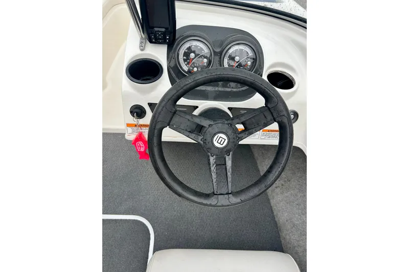 Slide: The Image of 2016 Bayliner 175 Bowrider steering wheel and dashboard with gauges. - 32