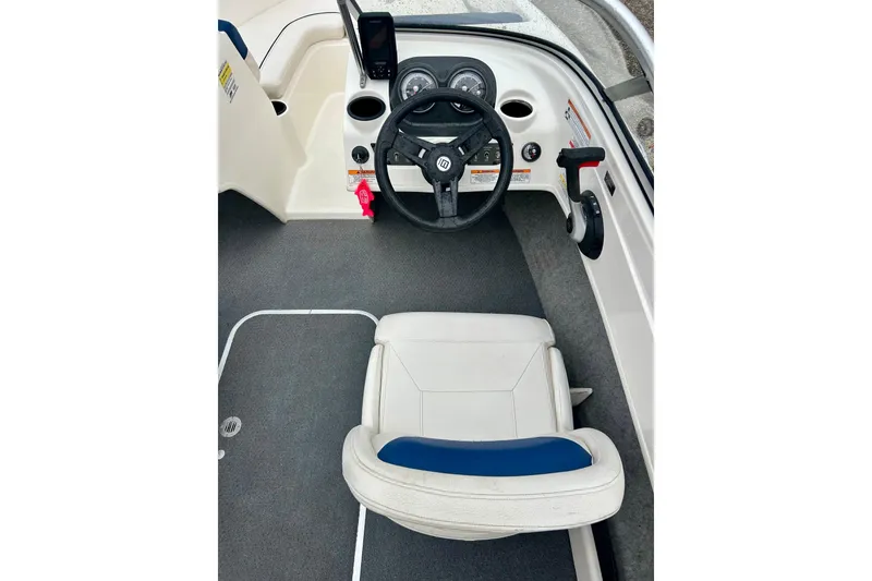 Slide: The Image of 2016 Bayliner 175 Bowrider cockpit with steering wheel and seating. - 33
