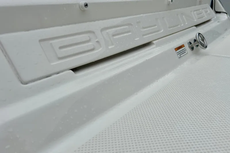 Slide: The Image of Close-up of 2016 Bayliner 175 Bowrider boat with embossed logo and textured surface. - 38