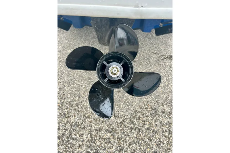 Slide: The Image of Propeller of a 2016 Bayliner 175 Bowrider boat on a wet surface. - 5