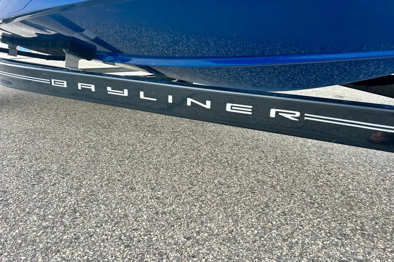 Slide: The Image of 2016 Bayliner 175 Bowrider trailer on pavement, showcasing brand logo. - 6