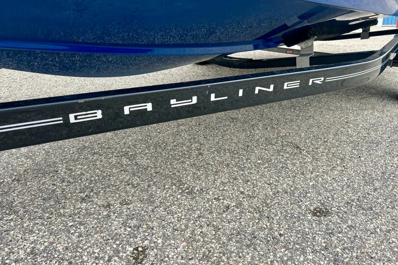 Slide: The Image of 2016 Bayliner 175 Bowrider trailer on pavement, showcasing brand logo. - 7