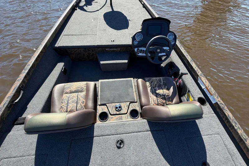 Slide: The Image of 2019 Ranger RT188P Fishing boat interior with steering console and seating on water. - 10