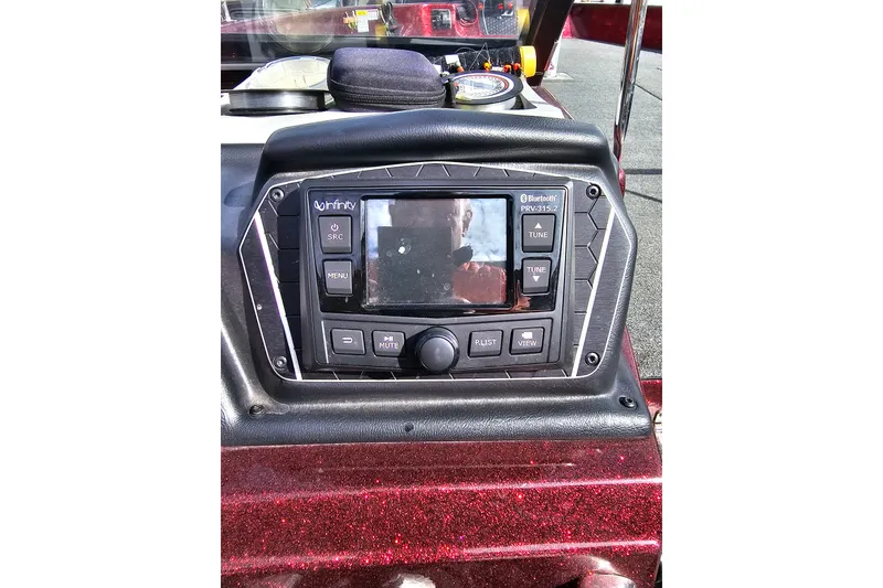 Slide: The Image of Infinity Bluetooth stereo system on 2023 Skeeter WX2200 boat dashboard. - 10