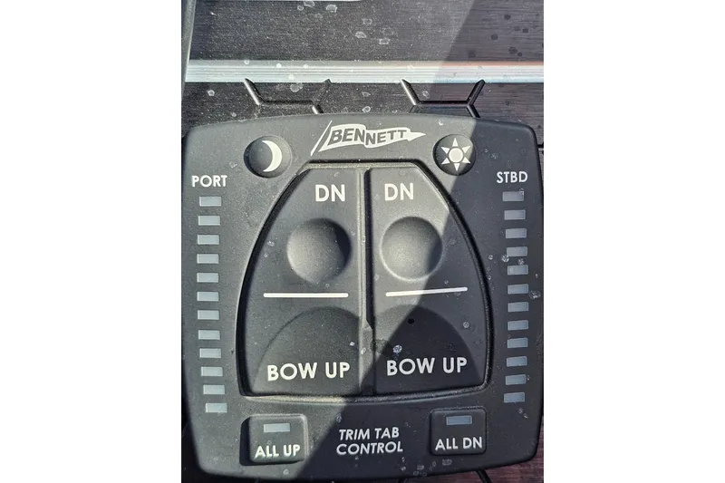 Slide: The Image of Bennett trim tab control panel on 2023 Skeeter WX2200 boat. - 13