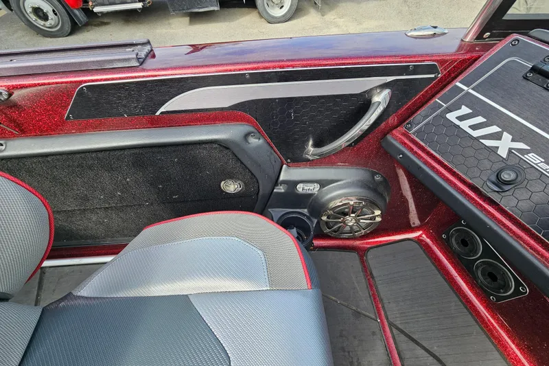 Slide: The Image of Interior of a 2023 Skeeter WX2200 boat, featuring sleek seating and modern design elements. - 15