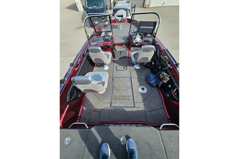Slide: The Image of 2023 Skeeter WX2200 boat interior with seating and fishing equipment. - 19