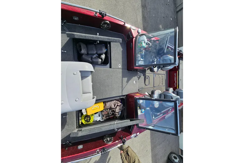 Slide: The Image of 2023 Skeeter WX2200 boat interior with open storage compartments and seating. - 20