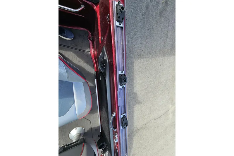 Slide: The Image of Interior view of a 2023 Skeeter WX2200 boat, showcasing seating and rail details. - 21