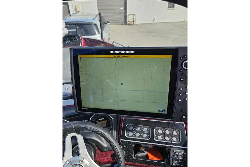 Slide: The Image of 2023 Skeeter WX2200 dashboard with Humminbird GPS display. - 24