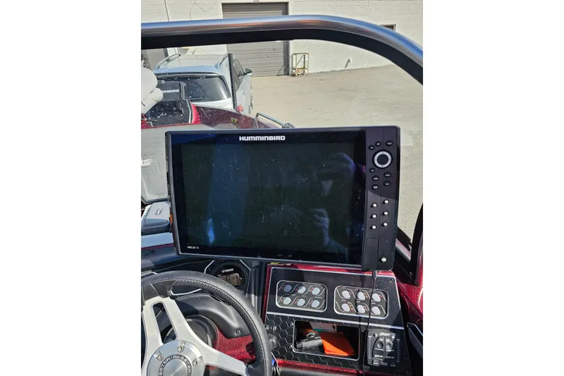 Slide: The Image of 2023 Skeeter WX2200 boat dashboard with Humminbird Helix 15 fishfinder display. - 26