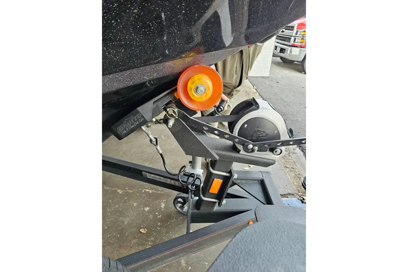 Slide: The Image of 2023 Skeeter WX2200 boat trailer hitch with orange roller and winch. - 3