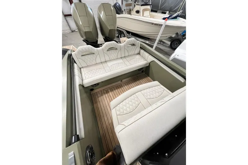 Slide: The Image of 2022 Technohull T9 boat interior with luxurious seating and dual outboard motors. - 15