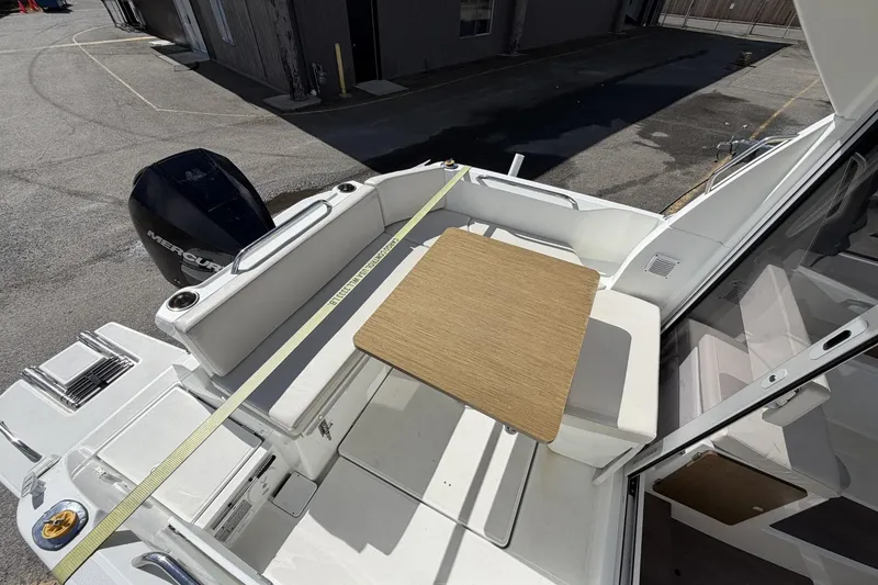 Slide: The Image of 2020 Beneteau Antares 7 boat interior with seating and table, featuring a Mercury engine. - 6