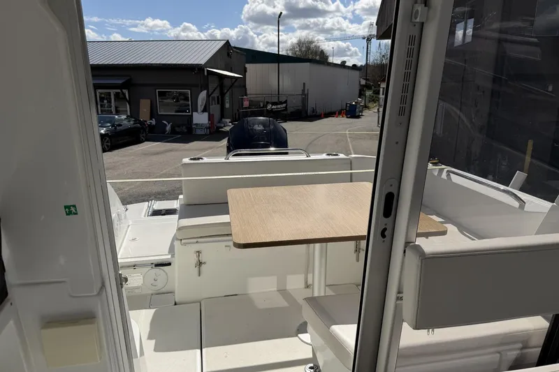 Slide: The Image of Interior view of 2020 Beneteau Antares 7 boat with seating and table. - 7