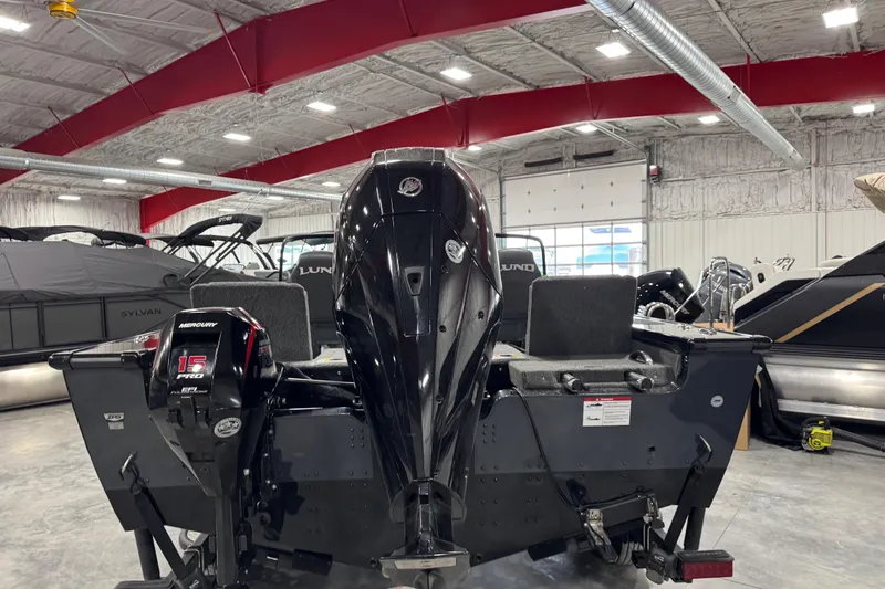 Slide: The Image of 2024 Lund 2075 Pro-V boat with Mercury 15 Pro outboard motor in showroom. - 5