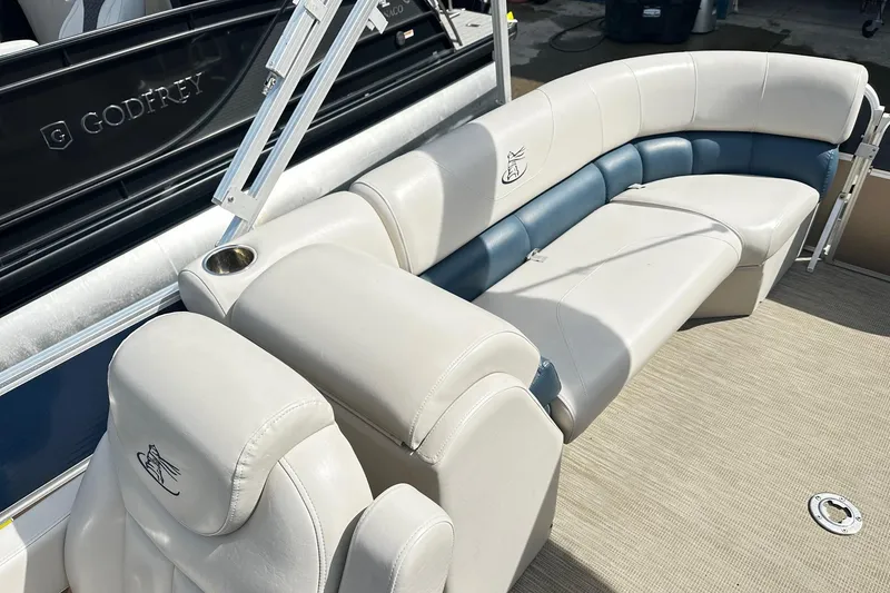 Slide: The Image of 2014 Misty Harbor 2286 Pontoon Salt Water Series with spacious seating and beige upholstery. - 10
