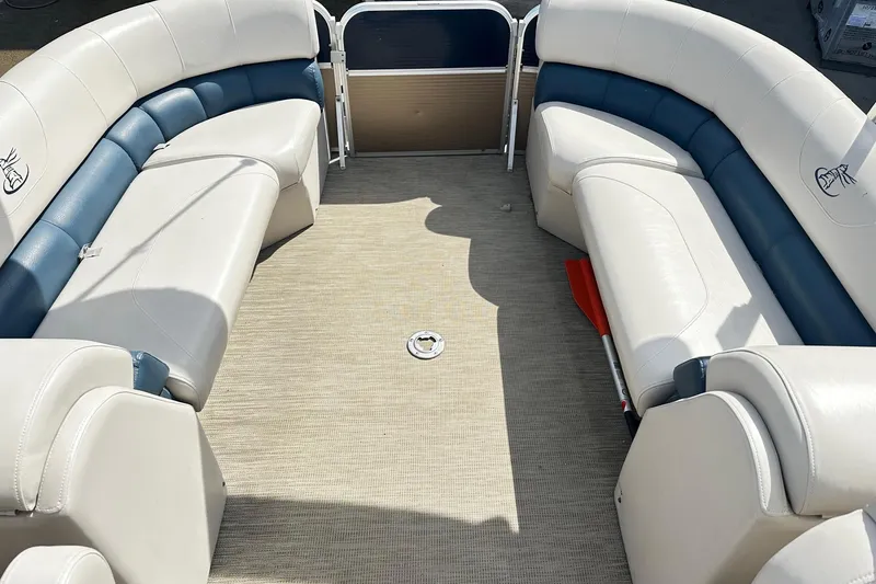 Slide: The Image of 2014 Misty Harbor 2286 Pontoon boat interior with white and blue seating. - 11