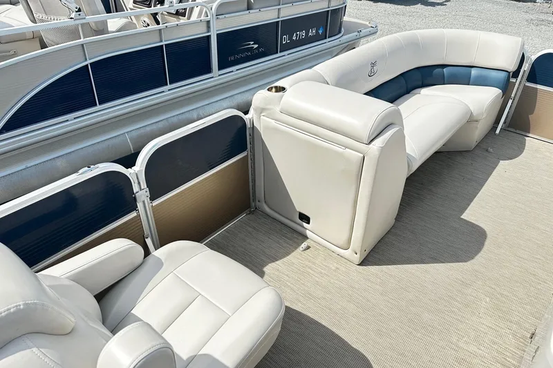 Slide: The Image of 2014 Misty Harbor 2286 Pontoon interior with beige and blue seating. - 12