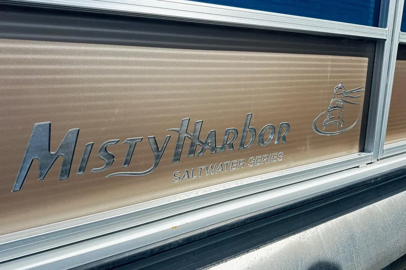 Slide: The Image of 2014 Misty Harbor 2286 Pontoon Salt Water Series logo on boat exterior. - 2