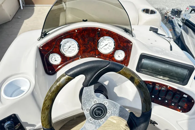 Slide: The Image of Steering console of 2014 Misty Harbor 2286 Pontoon Salt Water Series with gauges and controls. - 7