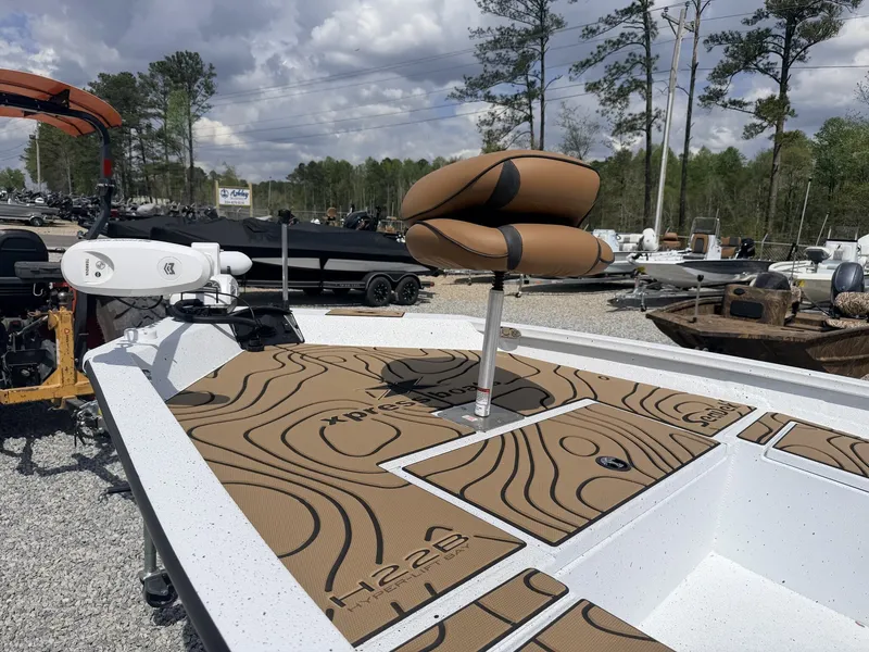 Slide: The Image of Xpress Hyper-Lift Series H22B-200HP-LOADED boat, 2026 model, on gravel lot. - 6