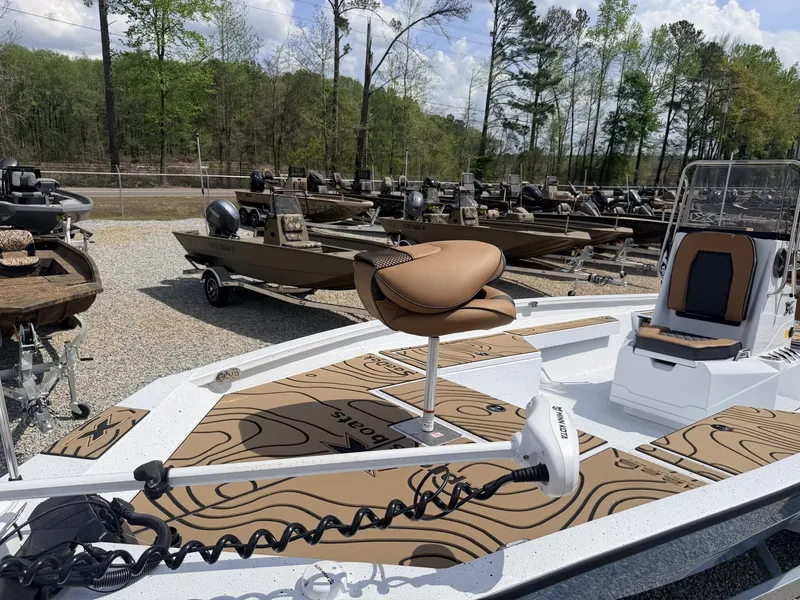 Slide: The Image of Xpress Hyper-Lift Series H22B-200HP-LOADED boat, 2026 model, in a parking lot. - 7