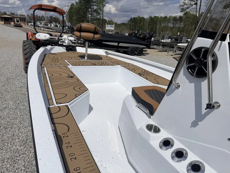 Slide: The Image of 2026 Xpress Hyper-Lift Series H22B-200HP-LOADED boat on gravel lot. - 9