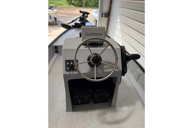 Slide: The Image of Steering console of 2026 Santee 160 Center Console boat with Garmin navigation. - 6