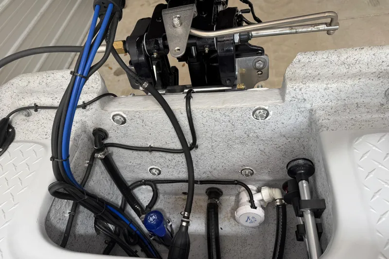 Slide: The Image of 2026 Santee 160 Center Console boat wiring and engine components close-up. - 7